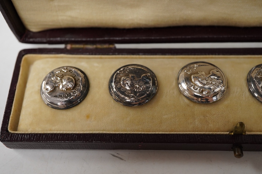 A cased set of six Edwardian small silver buttons, by Turner & Simpson, Chester, 1906, each embossed with the bust of a young lady, diameter 17mm.